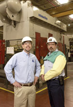 Arvin Sango Inc.39s plant manager Scott Hubbard (left) and production manager Randy Lockridge stand in front of the company39s 2,000-tonne steel press designed for stamping auto parts.