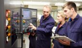 workers inspecting an electrical panel